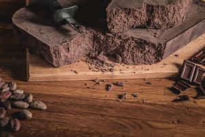 Link to chocolate making process page. Picture of a big block of dark chocolate.