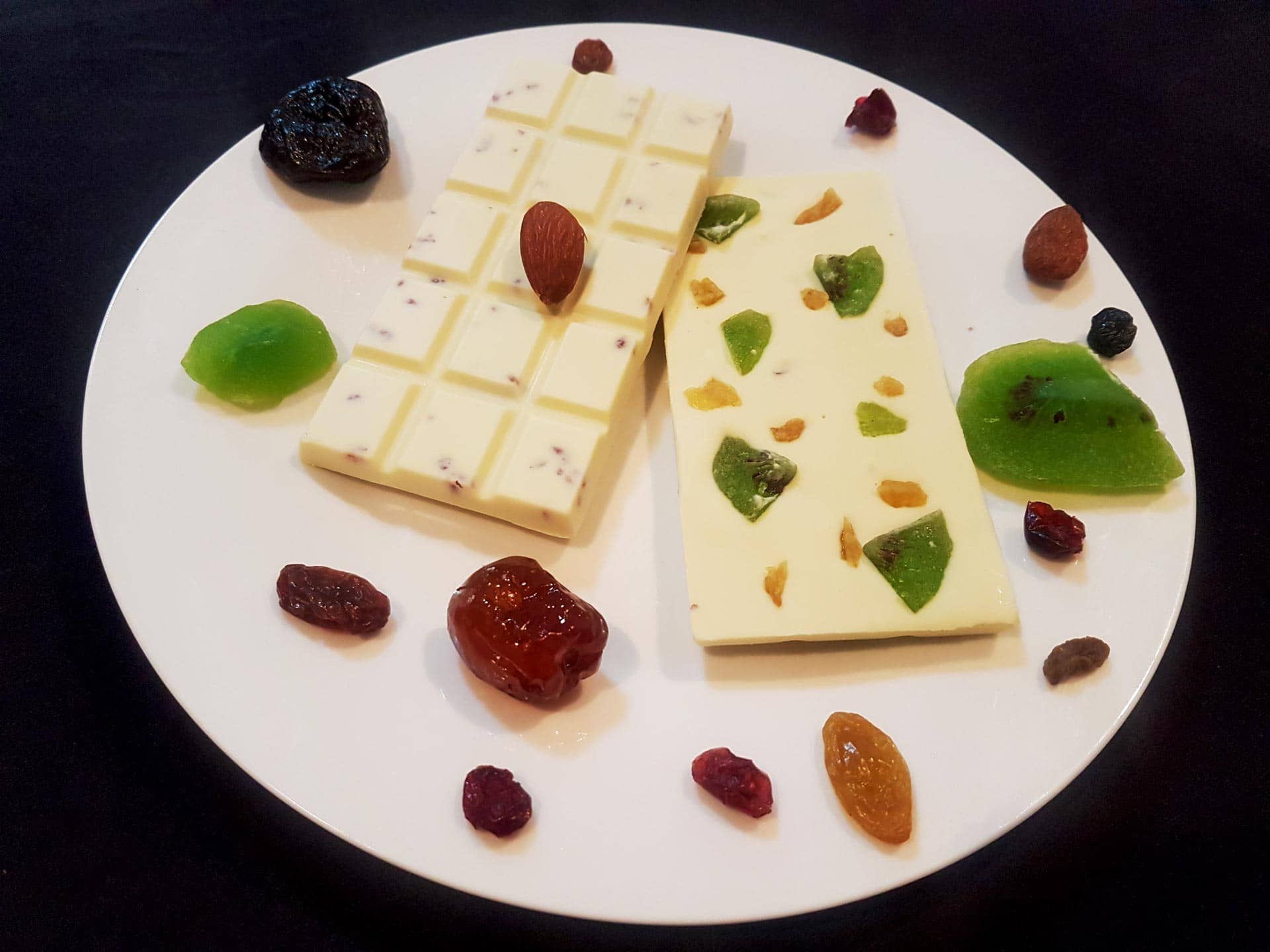 Fruity white chocolate surrounded by candied fruit.